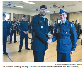 Bellerose Bulldog Gabriel Keith receiving his King Charles III Coronation Medal for his work with the community.